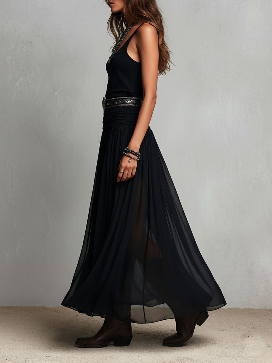 Abito lungo elasticizzato nero stile boho-western con gonna trasparente