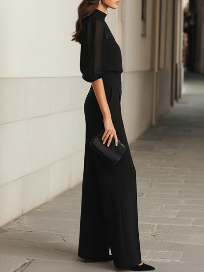 Set da tre pezzi nero, composto da top camisole trasparente e pantaloni a gamba larga